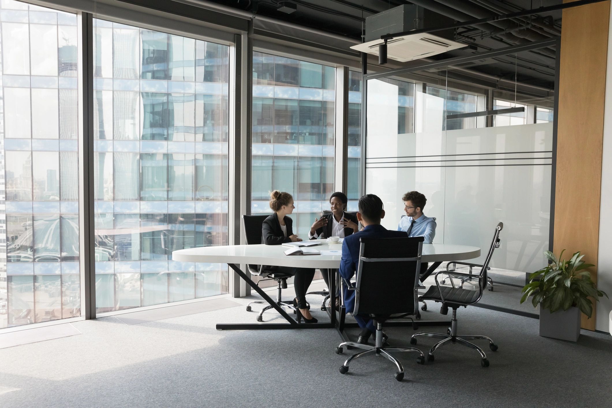 Consulting-style team discussion in a modern office