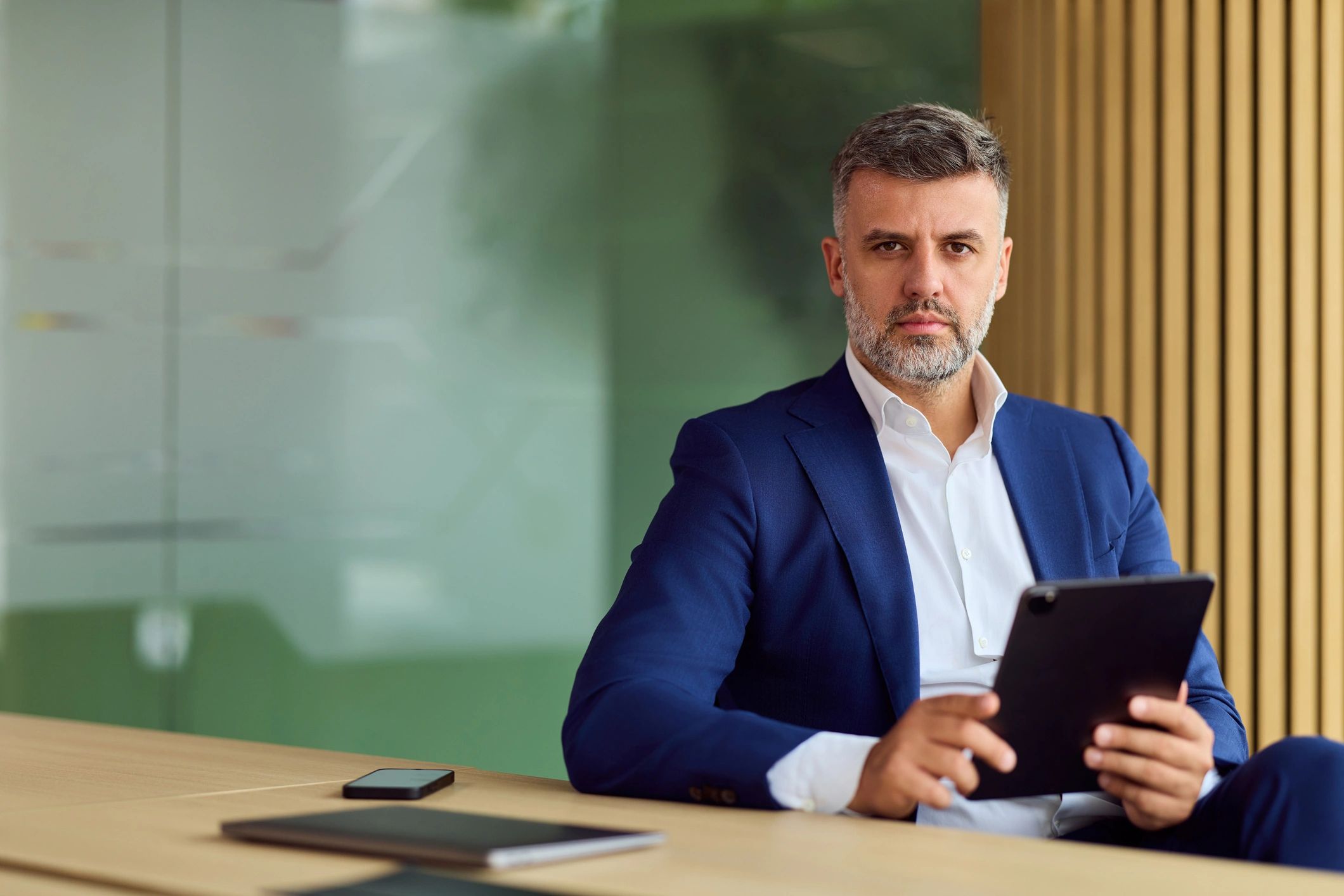 Professional consultant reviewing information in a modern office