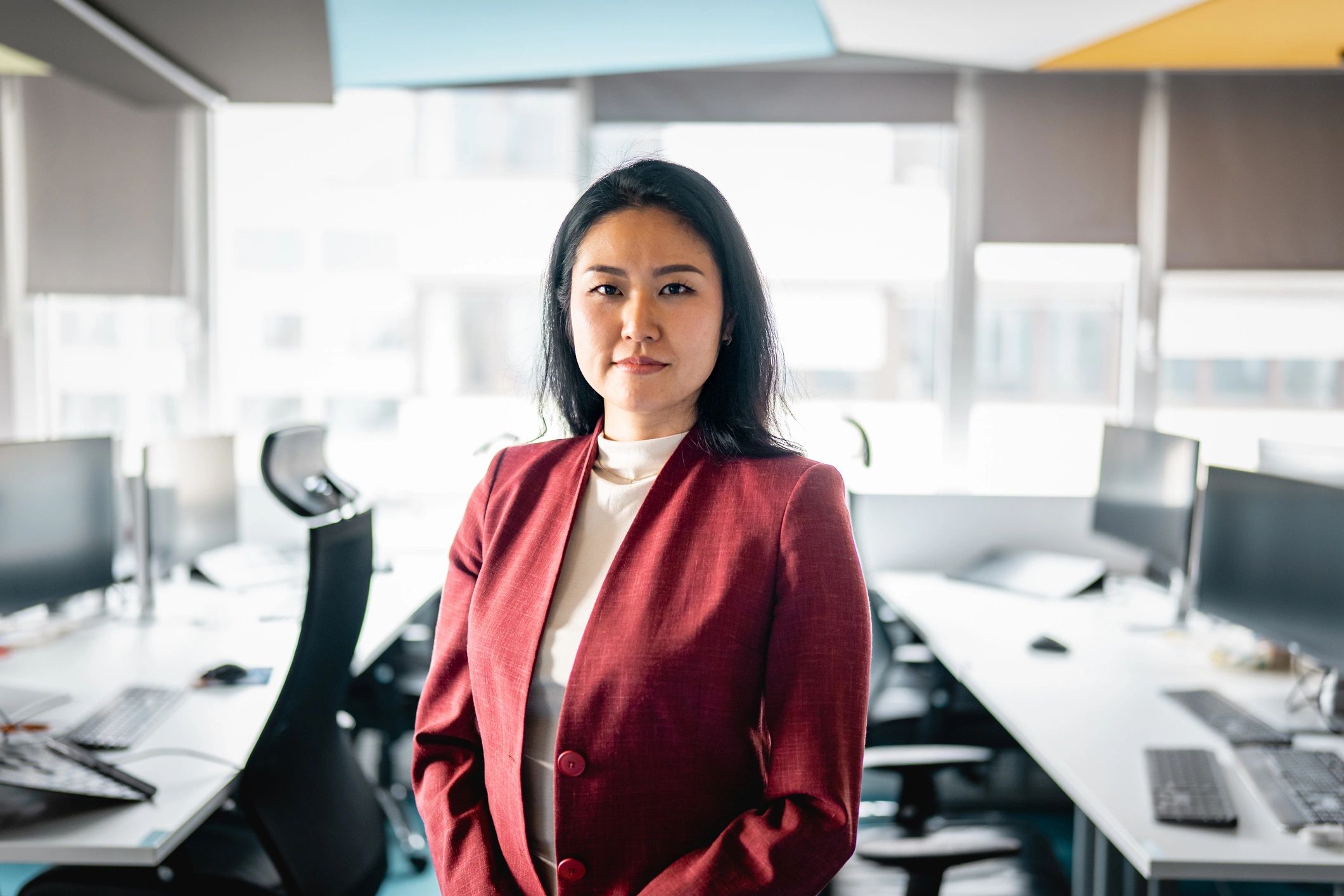 Business consultant standing in a bright office